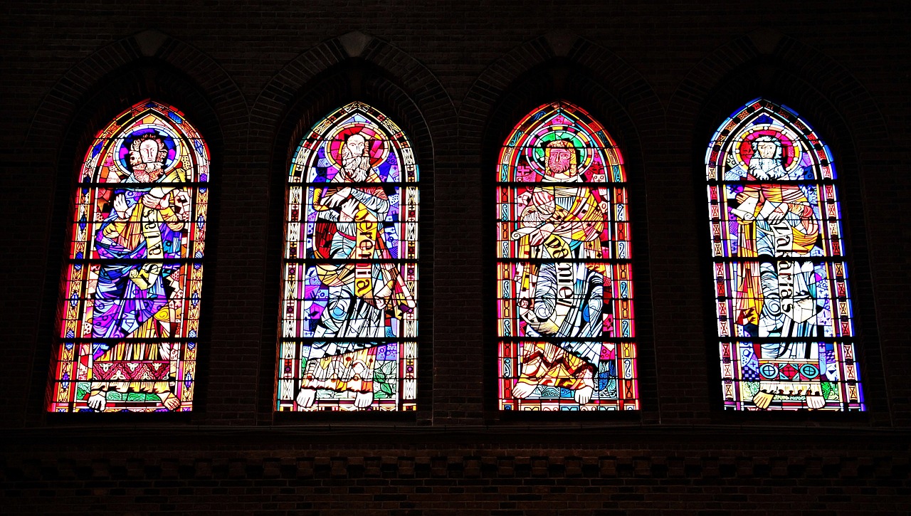 Four stained glass panels in a church