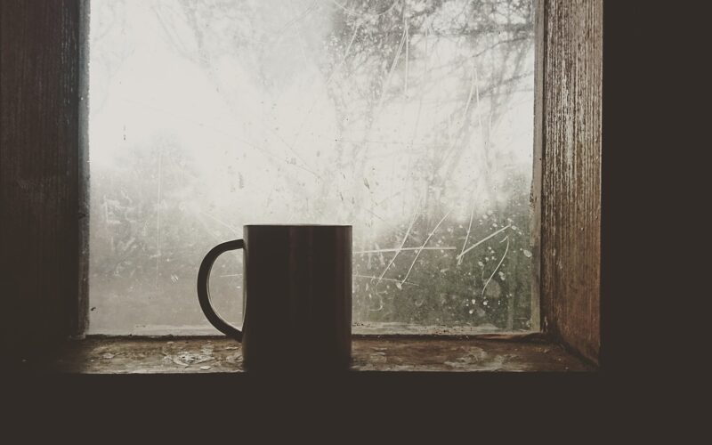 Mug of coffee on a window sill