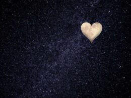 Heart-shaped moon in a starry sky