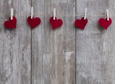 Paper hearts attached to a string by paperclips